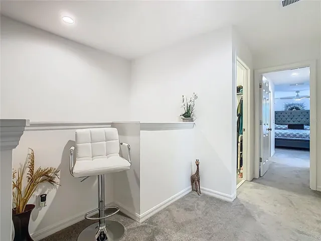 a view of walk in closet with clothes