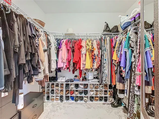 a bedroom with bed and flat screen tv