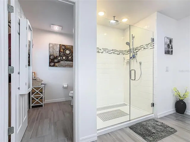 a bathroom with a toilet a sink and a window