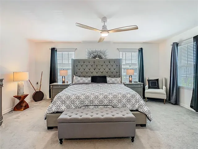 a front view of a house with potted plants