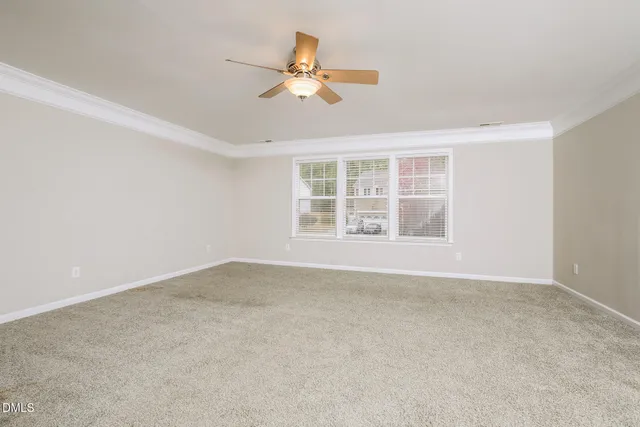 a view of a kitchen with wooden floor and cabinets