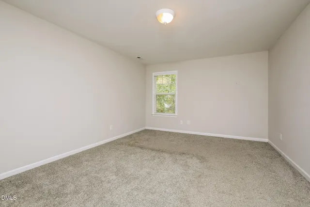 a bathroom with a sink a toilet a mirror and vanity