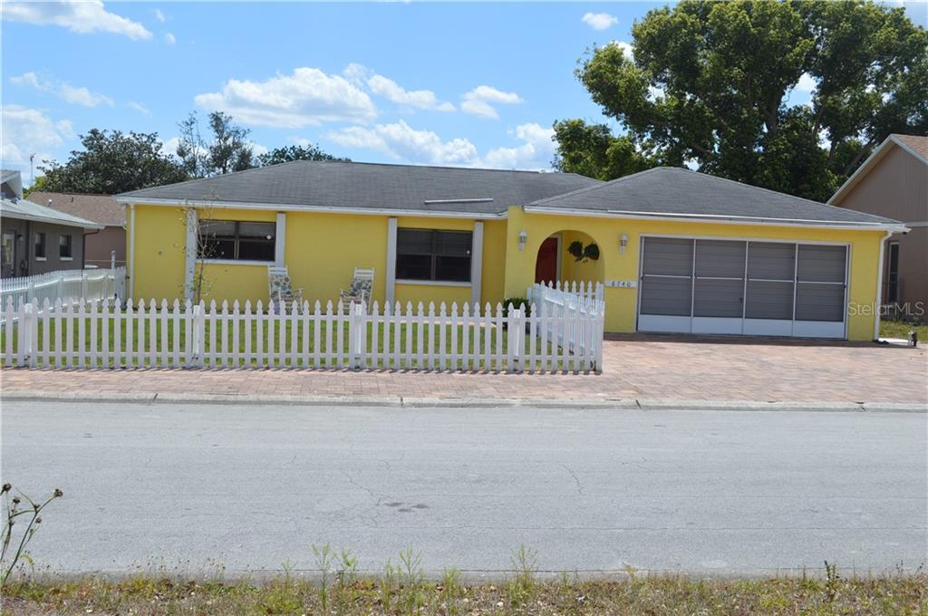 8740 Honeycomb Drive Port Richey, FL 34668 - Photo 1 of 1 front view of a house with a yard