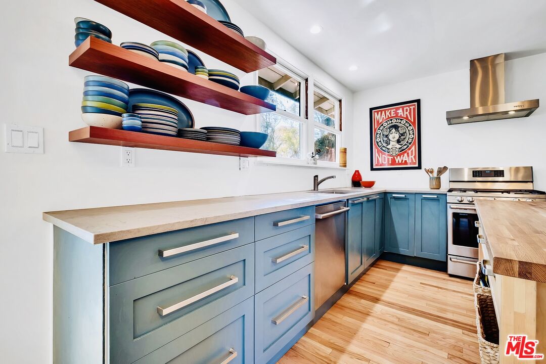 49 Ranchview Road Rolling Hills Estates, CA 90274 - Photo 14 of 49 a kitchen with stainless steel appliances a stove and cabinets