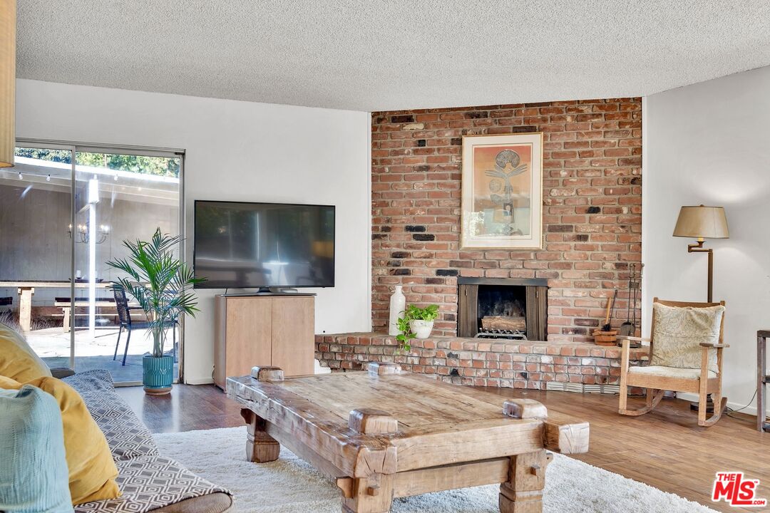 49 Ranchview Road Rolling Hills Estates, CA 90274 - Photo 21 of 49 a living room with fireplace furniture and a flat screen tv