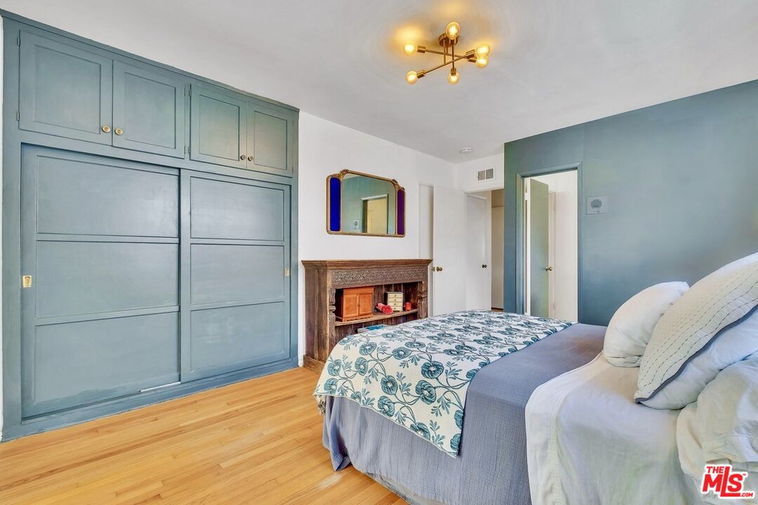 49 Ranchview Road Rolling Hills Estates, CA 90274 - Photo 33 of 49 a bedroom with a bed and a chandelier