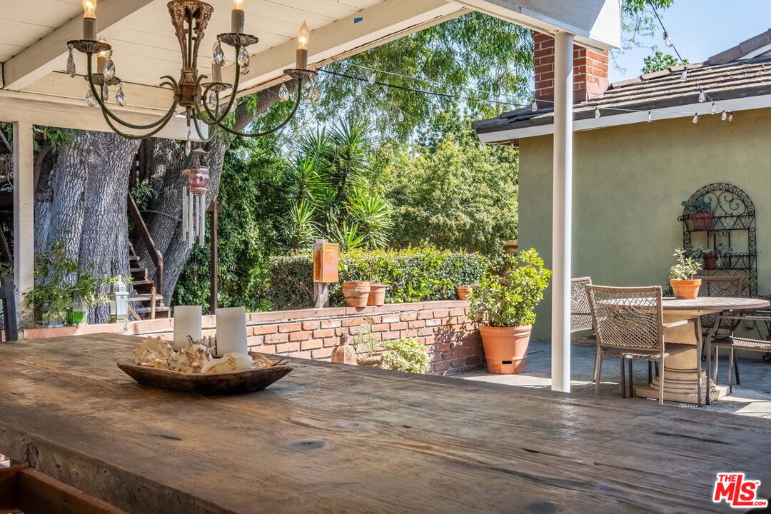 49 Ranchview Road Rolling Hills Estates, CA 90274 - Photo 38 of 49 a view of a patio with couches table and chairs and potted plants