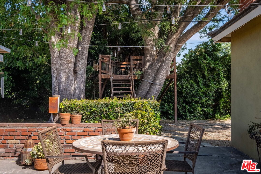 49 Ranchview Road Rolling Hills Estates, CA 90274 - Photo 39 of 49 a view of a chair and table in backyard
