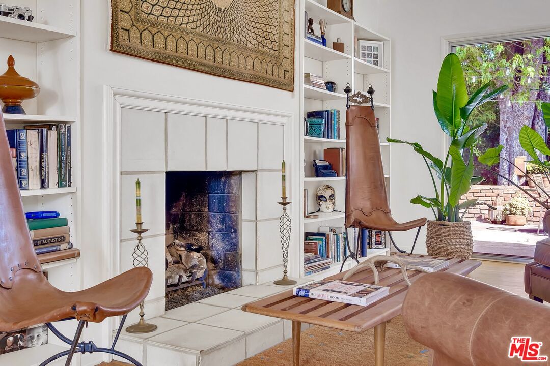 49 Ranchview Road Rolling Hills Estates, CA 90274 - Photo 6 of 49 a living room with fireplace furniture and a potted plant