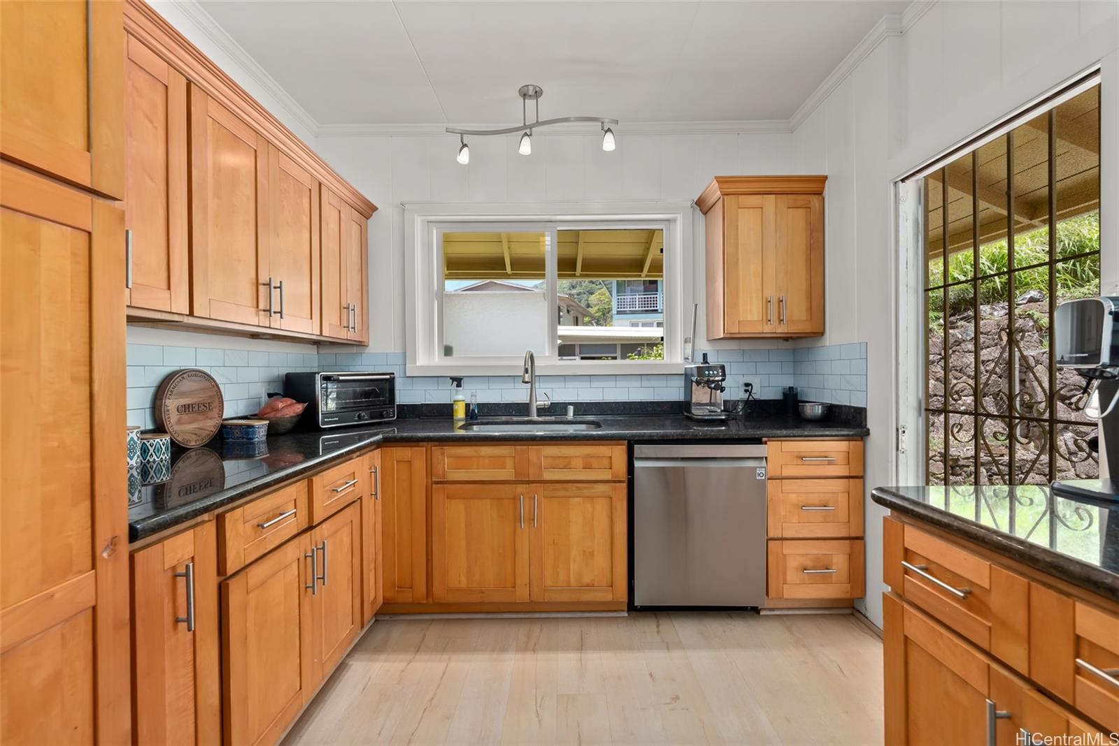 2811 Henry Street Honolulu, HI 96817 - Photo 9 of 25 Enjoy doing the dishes when you have a view like this! A large window perfectly frames the outside world, bringing joy to daily tasks.