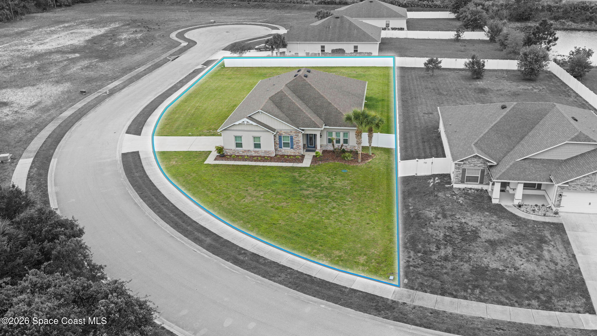 3441 Breezy Point Lane Cocoa, FL 32926 - Photo 3 of 8 an aerial view of a house with a swimming pool