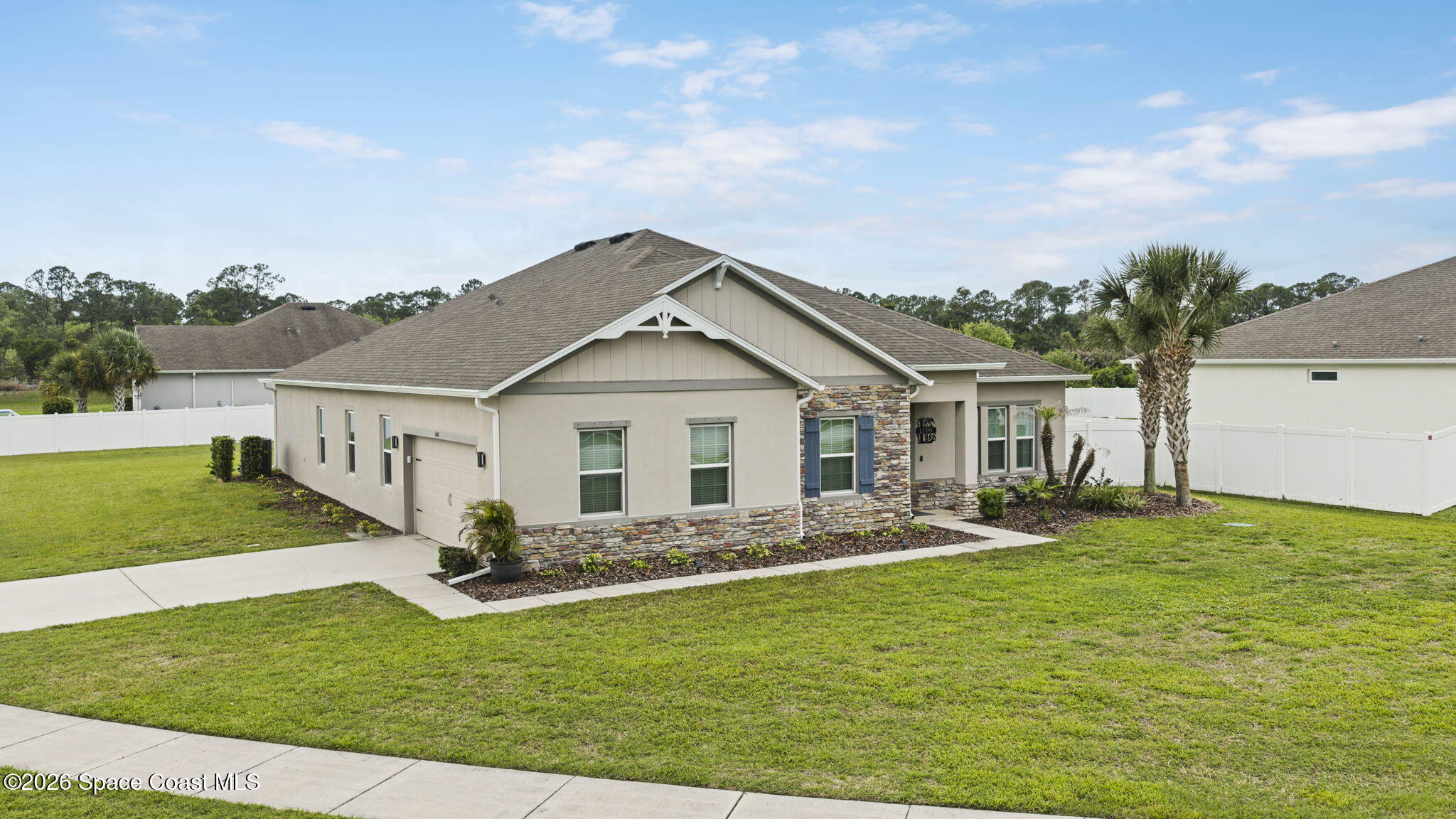 3441 Breezy Point Lane Cocoa, FL 32926 - Photo 4 of 8 a front view of house with yard and green space