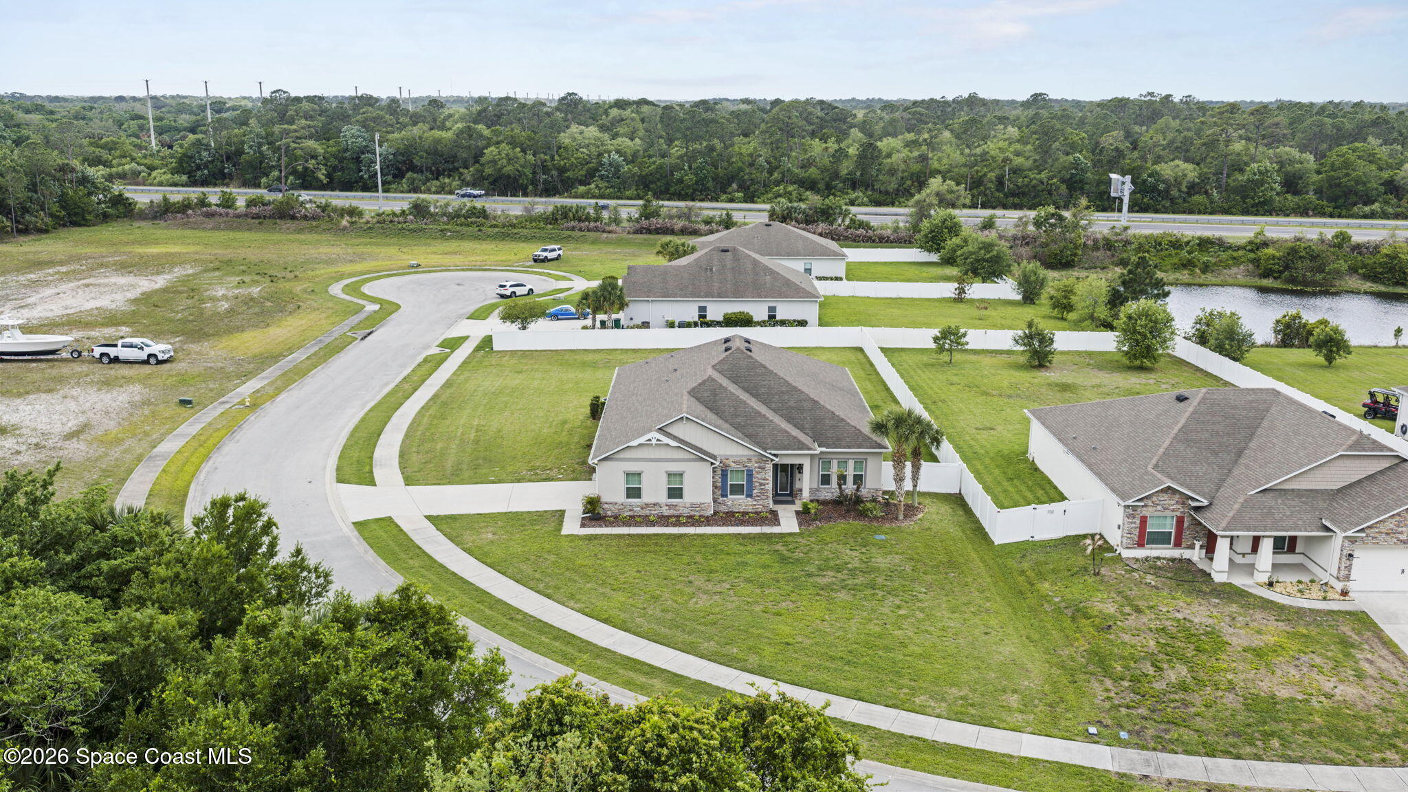 3441 Breezy Point Lane Cocoa, FL 32926 - Photo 5 of 8 an aerial view of a house with a swimming pool