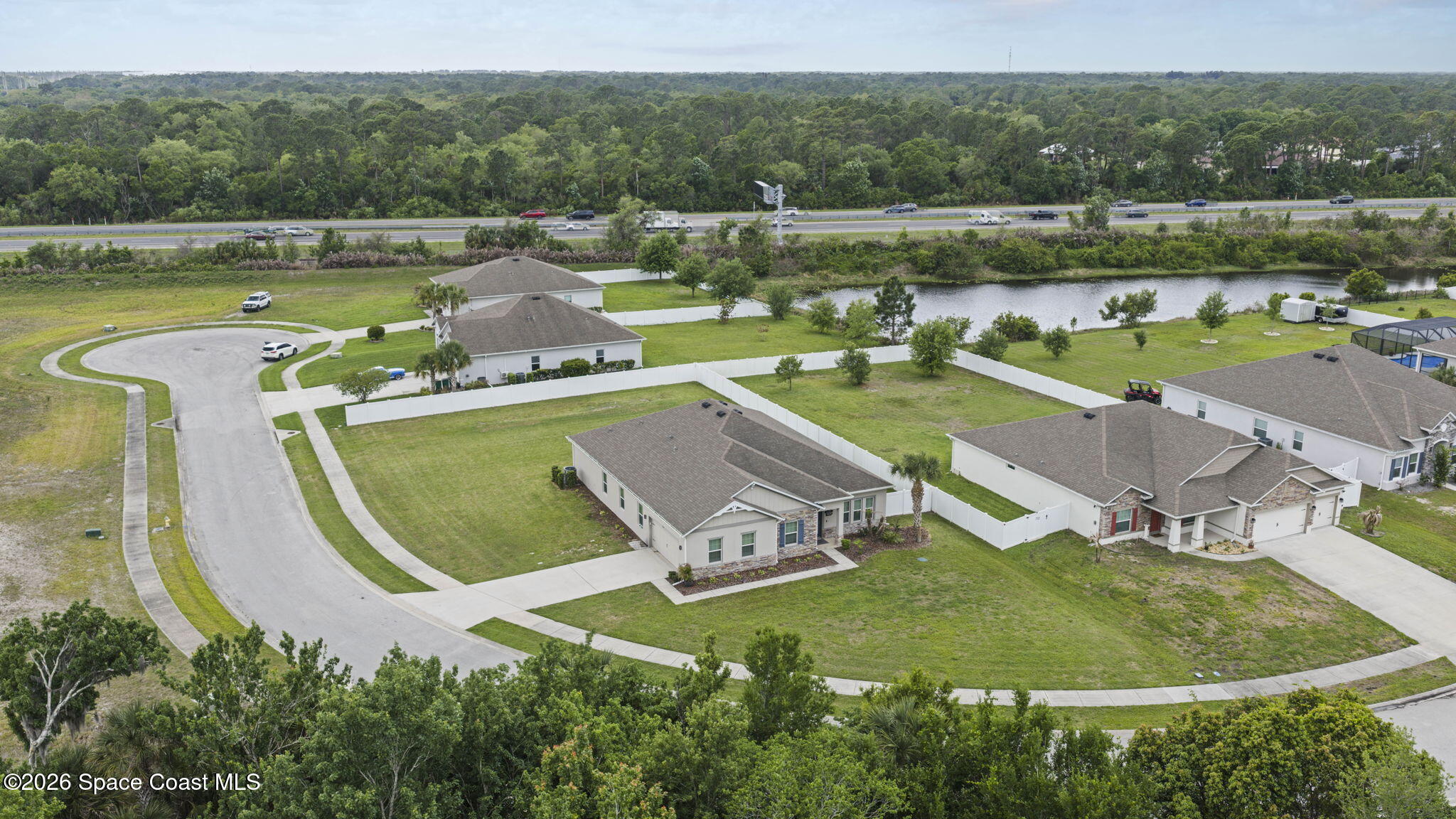 3441 Breezy Point Lane Cocoa, FL 32926 - Photo 7 of 8 an aerial view of a house with a lake view