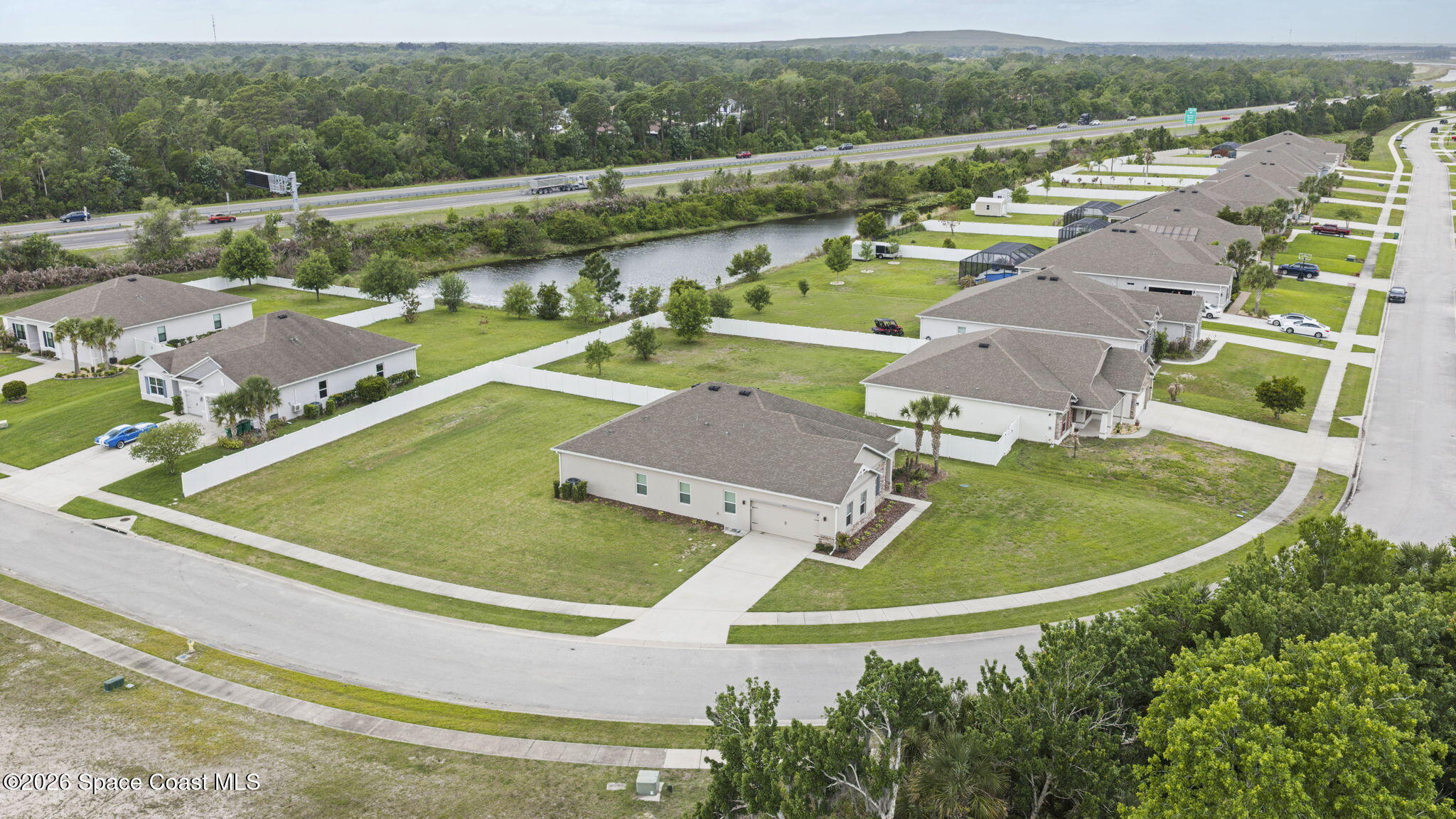 3441 Breezy Point Lane Cocoa, FL 32926 - Photo 8 of 8 an aerial view of residential houses with outdoor space and pool