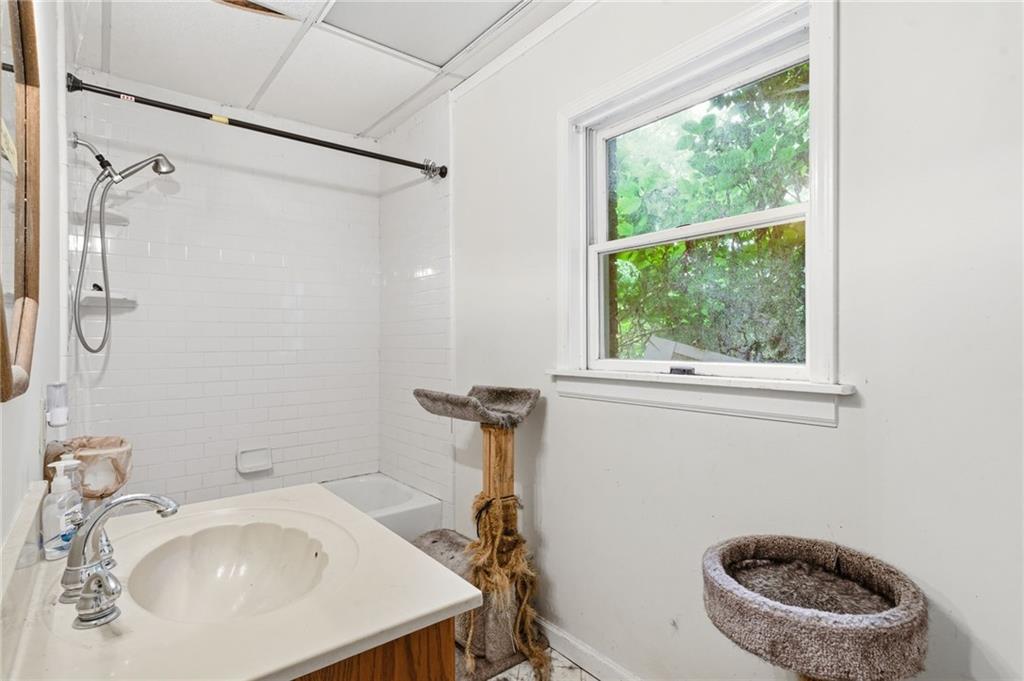 100 Wilson Road Covington, GA 30016 - Photo 22 of 54 a bathroom with a sink a toilet and a mirror