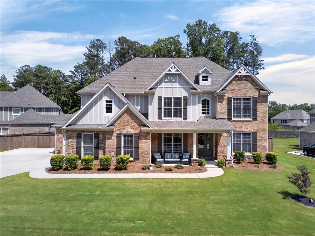 139 Manchester Lane Villa Rica, GA 30180 - Photo 49 of 60 a front view of a house with yard and lake view