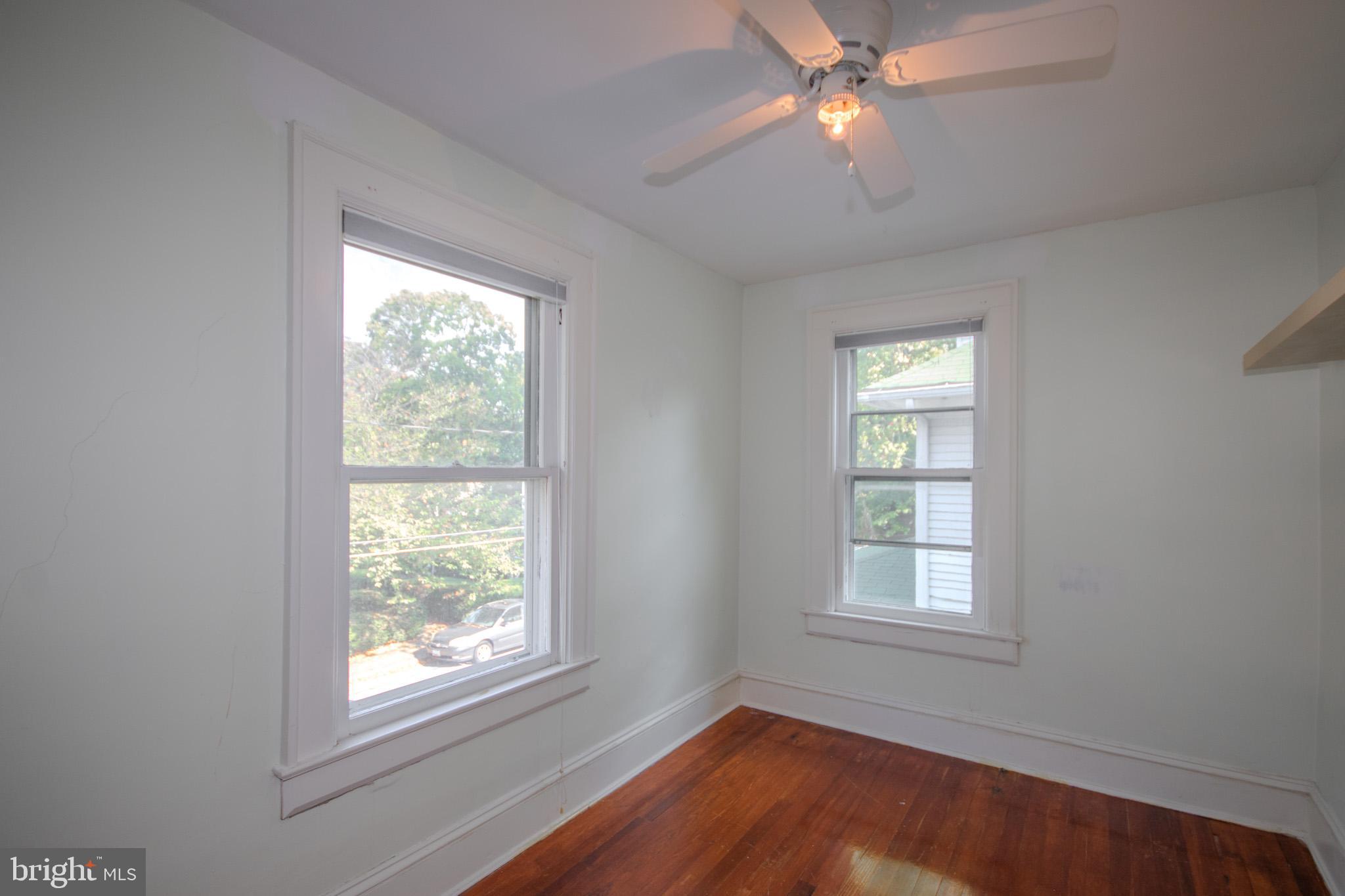 309 Gay Street Salisbury, MD 21801 - Photo 33 of 54 an empty room with windows and fan