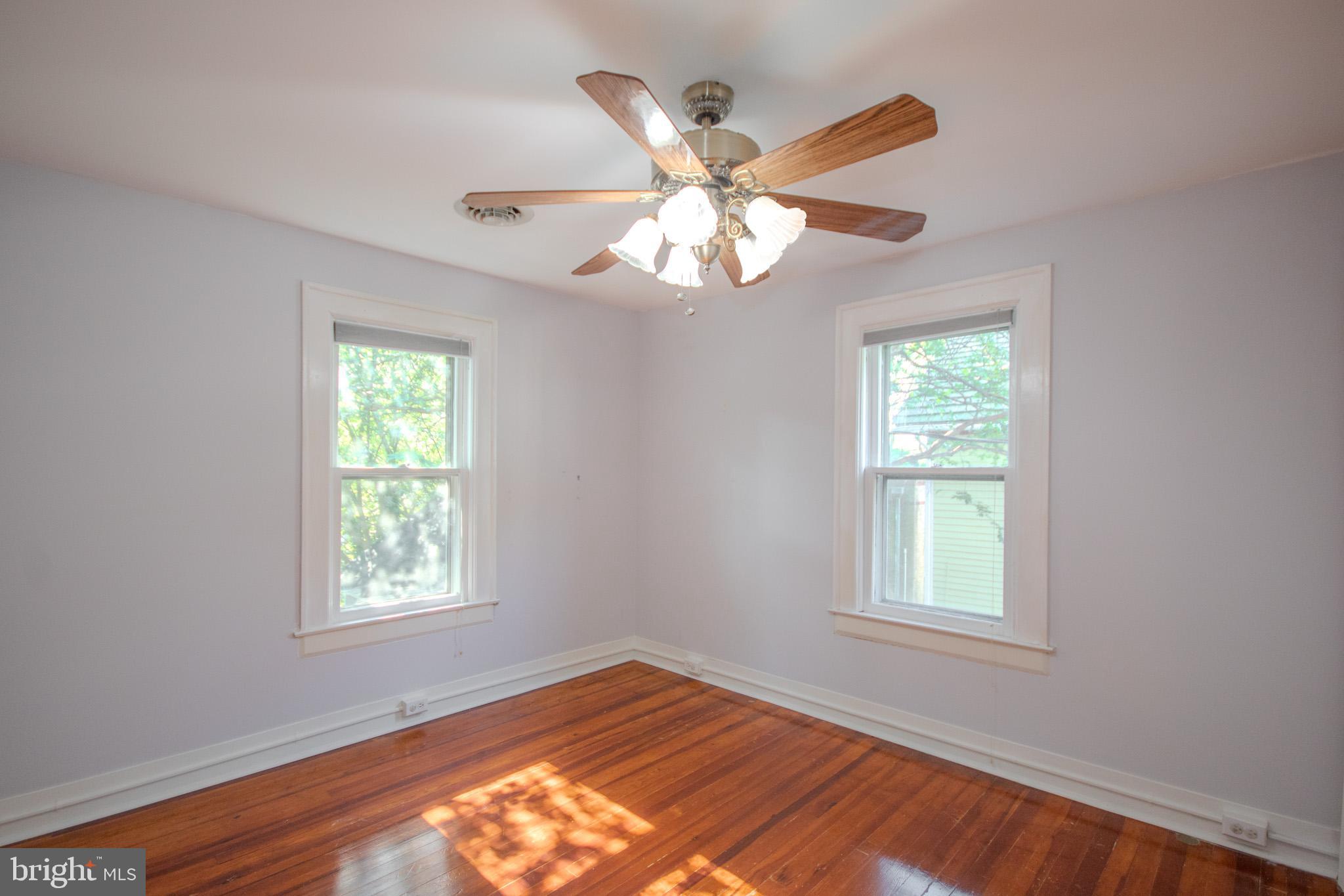 309 Gay Street Salisbury, MD 21801 - Photo 36 of 54 a view of an empty room with wooden floor and a window