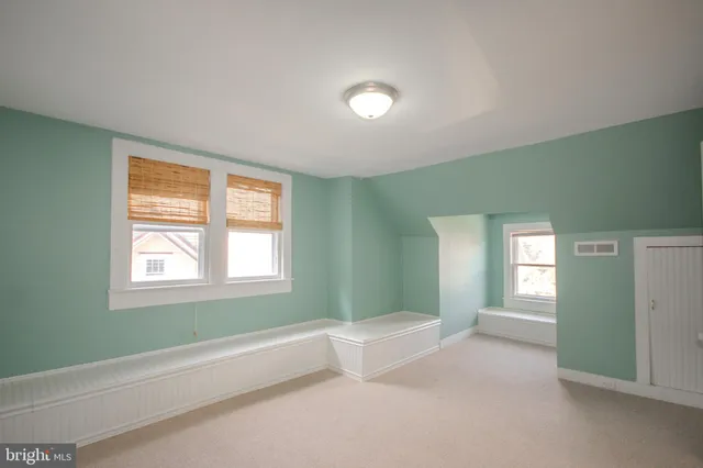 a view of empty room with wooden walls