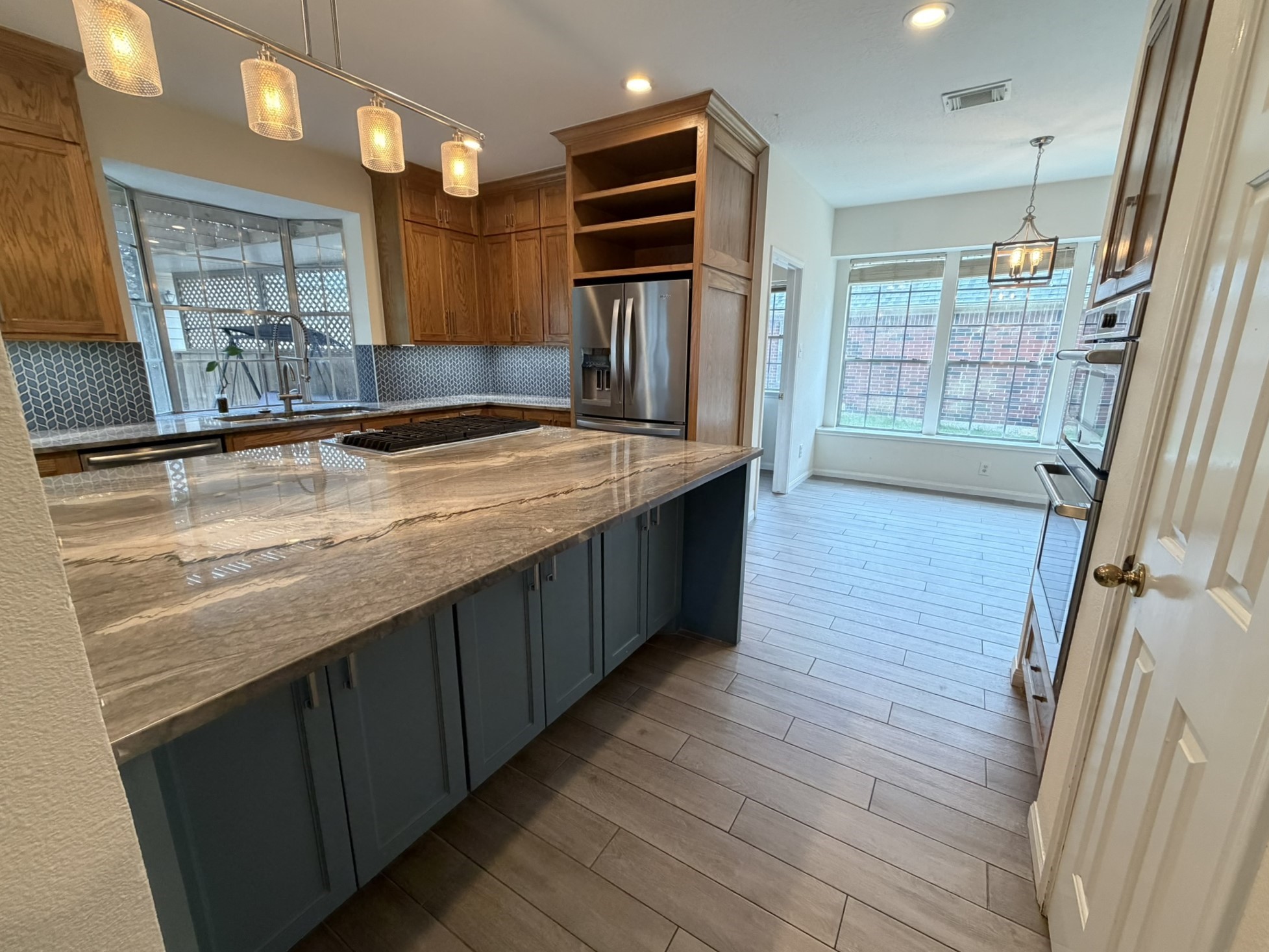 13810 Inland Spring Court Houston, TX 77059 - Photo 12 of 27 Pantry and double oven to the right