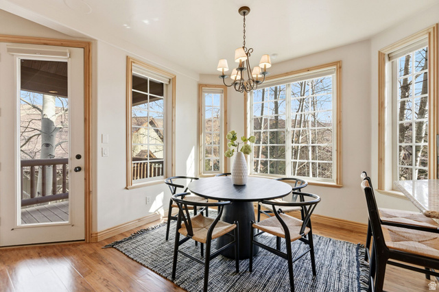 3026 Lower Saddleback Road Park City, UT 84098 - Photo 12 of 71 Dining room featuring light wood-style flooring, healthy amount of natural light, and a chandelier