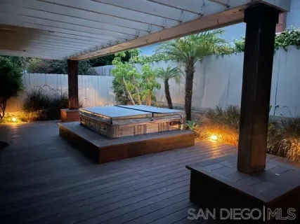 a swimming pool with outdoor seating and yard