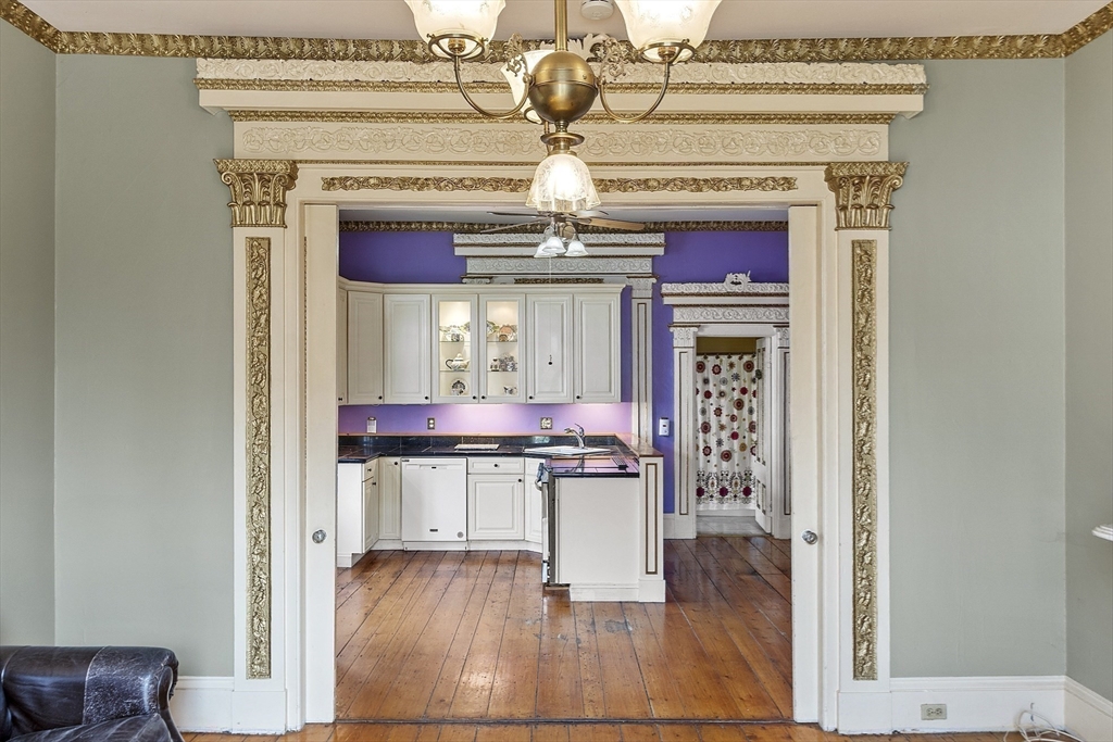 214 3rd Street, Unit A Lowell, MA 01850 - Photo 2 of 32 a view of dining room with wooden floor and chandelier