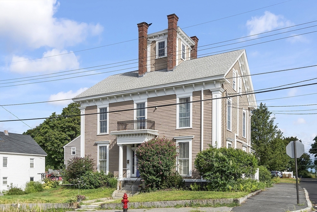 214 3rd Street, Unit A Lowell, MA 01850 - Photo 24 of 32 a front view of a house with garden