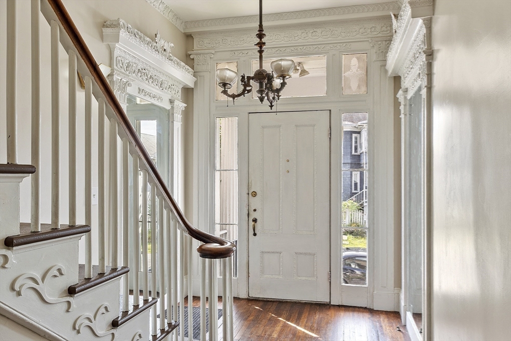 214 3rd Street, Unit A Lowell, MA 01850 - Photo 28 of 32 a view of a hallway with wooden floor and staircase