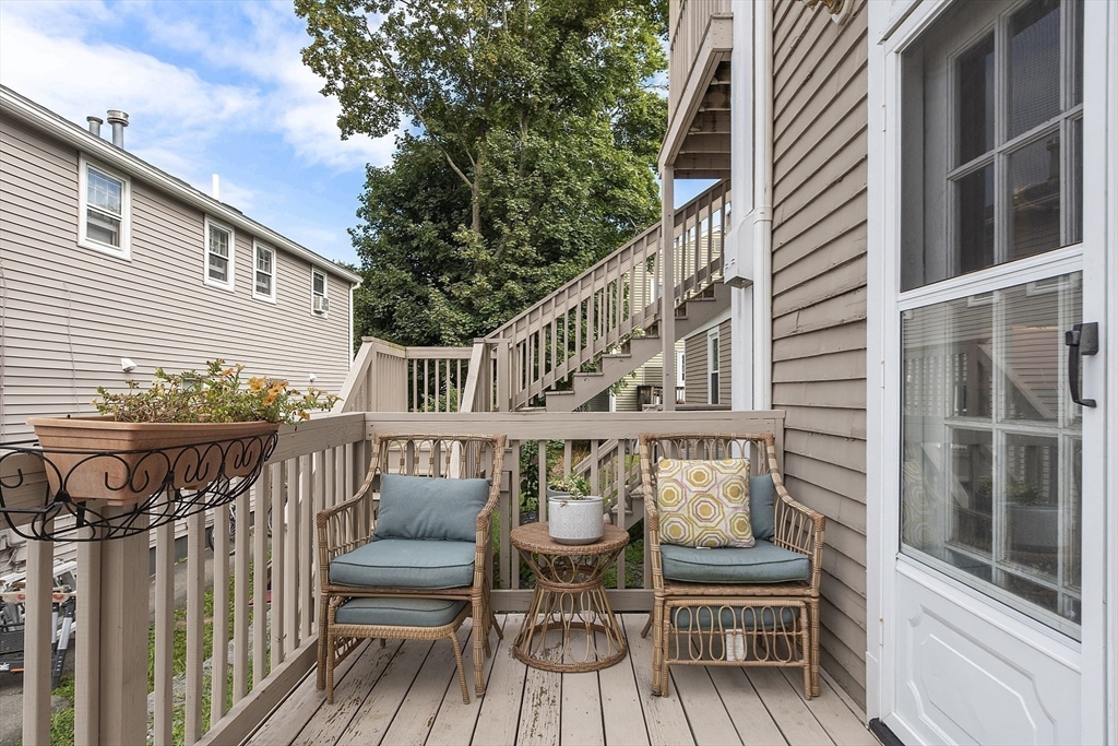 214 3rd Street, Unit A Lowell, MA 01850 - Photo 32 of 32 a view of a chair and table on the deck