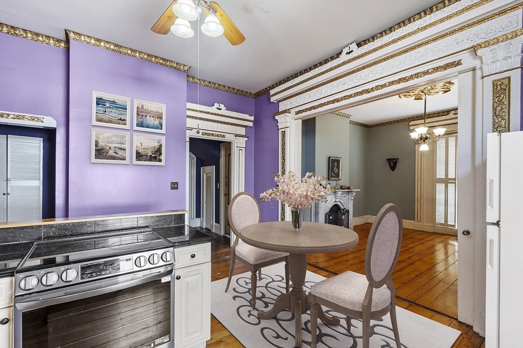 214 3rd Street, Unit A Lowell, MA 01850 - Photo 8 of 32 a dining room with furniture and window