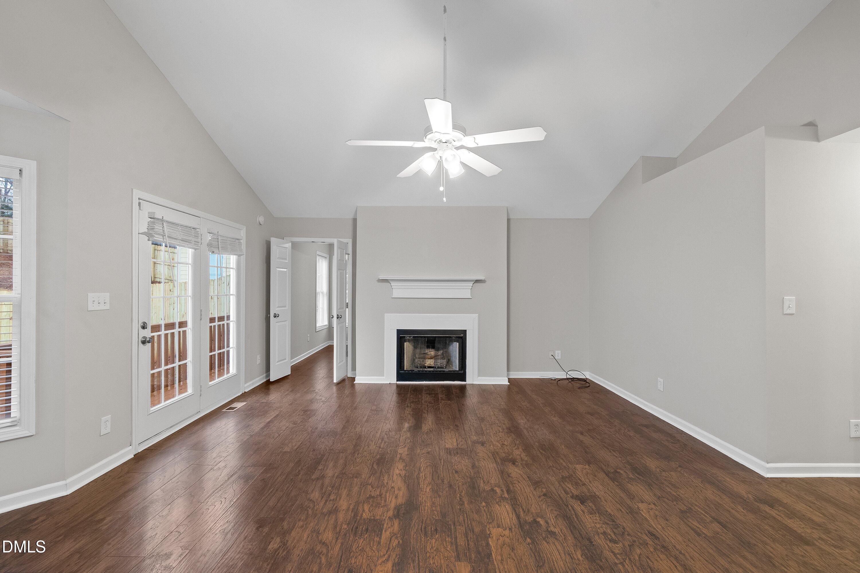 140 Melksham Road Wake Forest, NC 27587 - Photo 11 of 34 a view of a livingroom with wooden floor a fireplace