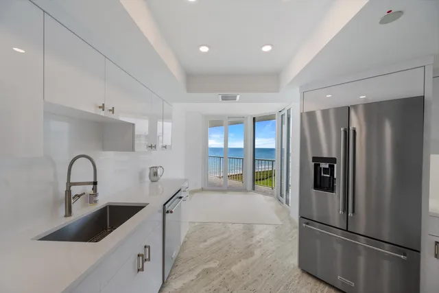 a kitchen with stainless steel appliances a refrigerator and a sink