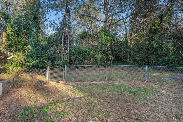 a backyard of a house with lots of green space
