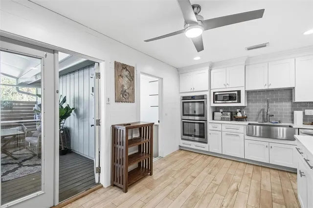 a bathroom with a granite countertop sink toilet and a mirror