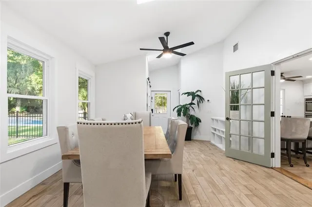 an aerial view of residential house with outdoor space and trees all around