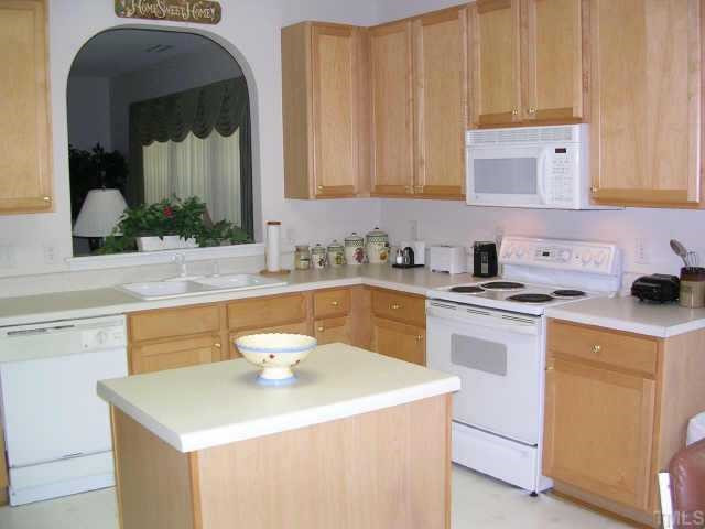 4828 Heatherfield Way Raleigh, NC 27604 - Photo 6 of 12 Large kitchen has island with electricity and lots of cabinets Other