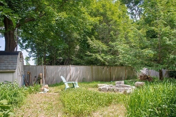141 Hale Street, Unit 2 Beverly, MA 01915 - Photo 11 of 17 a backyard of a house with green landscape