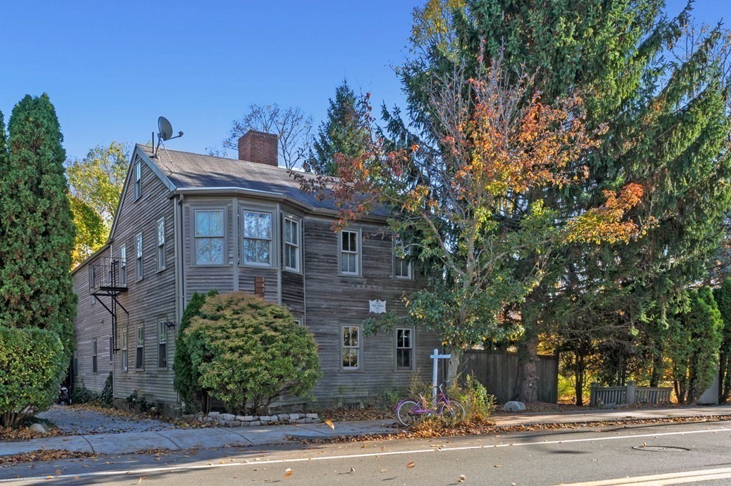 141 Hale Street, Unit 2 Beverly, MA 01915 - Photo 2 of 17 a front view of a house with a yard