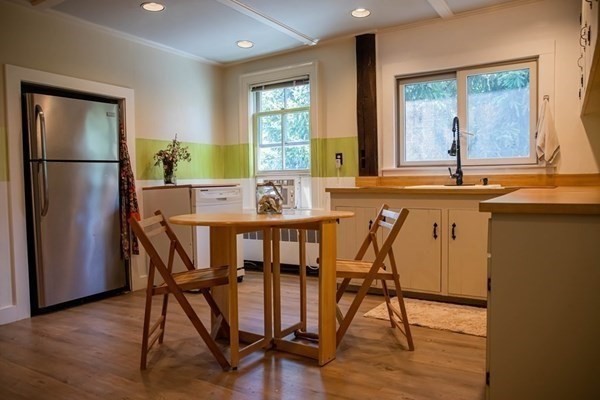 141 Hale Street, Unit 2 Beverly, MA 01915 - Photo 3 of 17 a view of a dining room with furniture window and wooden floor