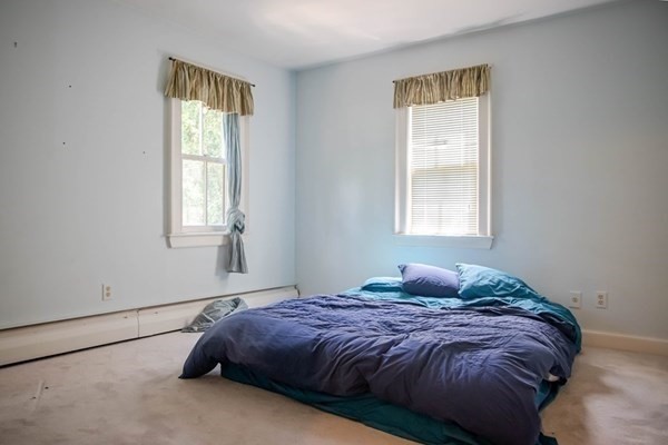 141 Hale Street, Unit 2 Beverly, MA 01915 - Photo 9 of 17 a bedroom with a bed and a window