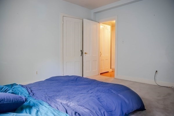 141 Hale Street, Unit 2 Beverly, MA 01915 - Photo 10 of 17 a bedroom with a bed and a window