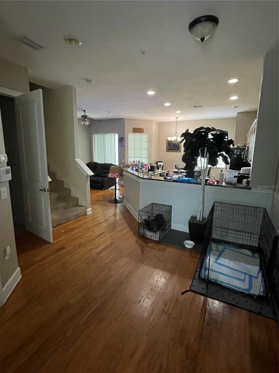 8405 Costa Bella Way Temple Terrace, FL 33637 - Photo 3 of 6 a living room with furniture and a wooden floor