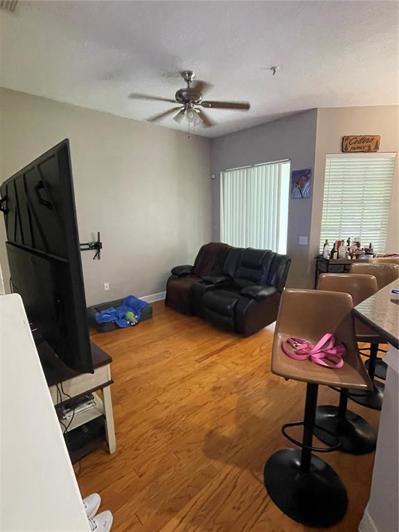 8405 Costa Bella Way Temple Terrace, FL 33637 - Photo 4 of 6 a living room with furniture and a window