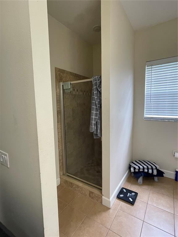 8405 Costa Bella Way Temple Terrace, FL 33637 - Photo 6 of 6 a bathroom with a glass shower door
