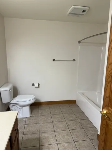 a bathroom with a sink vanity and mirror