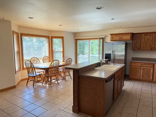 a kitchen with stainless steel appliances granite countertop a stove and a sink