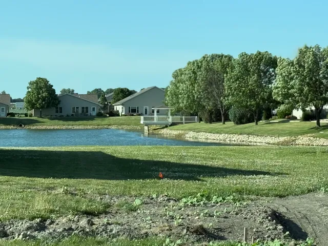 a view of a park and trees in the background