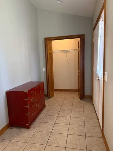 a room with a dresser and a window